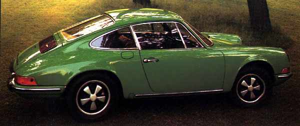 A green 1972 911 T with flap for the oil tank behind the right door.