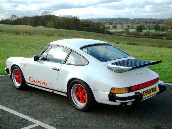 White 1988 Porsche 911 Carrera CS, seen from behind