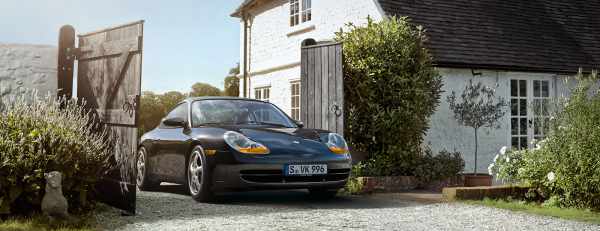 Black Porsche 996 seen from the front.